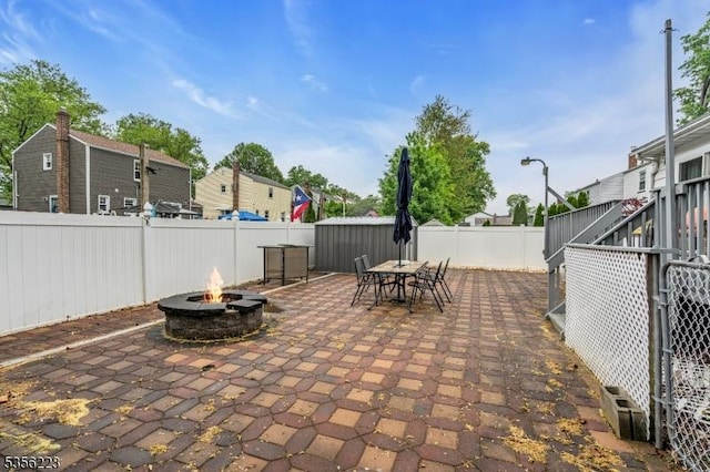 548 Birchwood Rd, Linden City, NJ 07036 - view of patio / terrace featuring a fire pit, a fenced backyard, and outdoor dining space