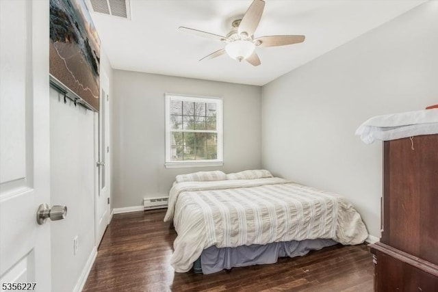 10 Longview Rd, Andover Twp, NJ 07860 - bedroom featuring a baseboard heating unit, wood finished floors, baseboards, and a ceiling fan