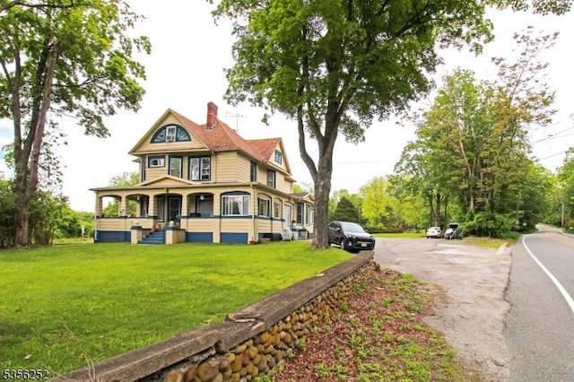 111 Decker Pond Rd, Green Twp, NJ 07821 - rear view of property with covered porch, a lawn, and a chimney