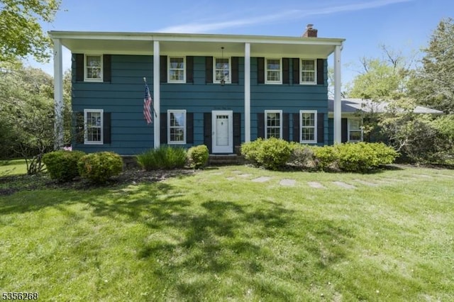 1341 Crim Rd, Bridgewater Twp, NJ 08807 - view of front of house with a chimney and a front lawn