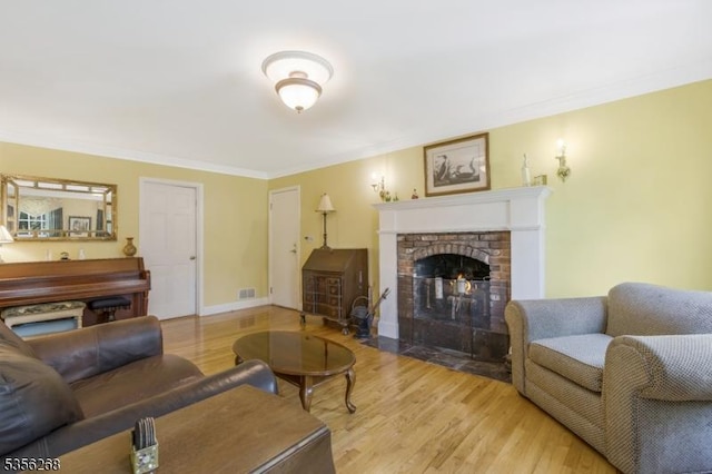 1341 Crim Rd, Bridgewater Twp, NJ 08807 - living area with crown molding, a fireplace, and light wood finished floors