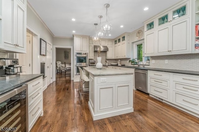 30 Southgate Dr, Clinton Twp, NJ 08801 - kitchen featuring appliances with stainless steel finishes, wine cooler, crown molding, exhaust hood, and decorative backsplash