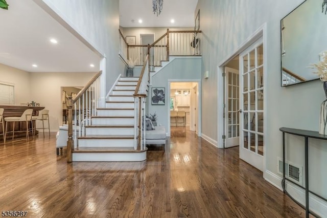 30 Southgate Dr, Clinton Twp, NJ 08801 - staircase with a towering ceiling, wood finished floors, recessed lighting, baseboards, and french doors