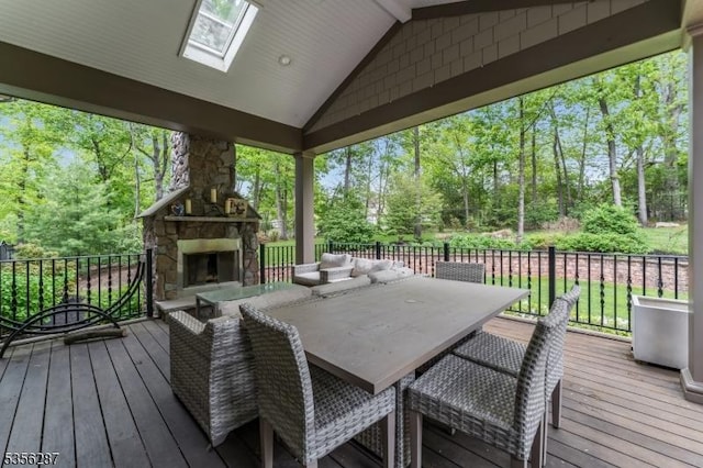30 Southgate Dr, Clinton Twp, NJ 08801 - wooden deck with an outdoor stone fireplace, view of wooded area, and fence