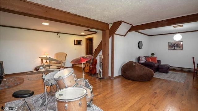 6 Longview Ln, Vernon Twp, NJ 07461 - living room featuring beamed ceiling, wood finished floors, a textured ceiling, ornamental molding, and baseboards