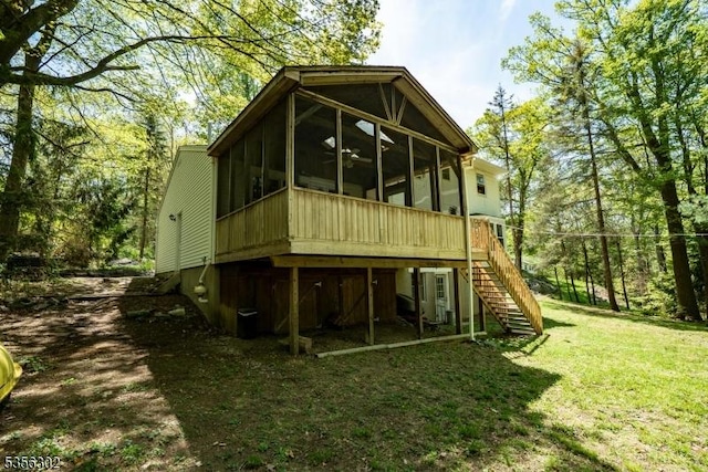 6 Longview Ln, Vernon Twp, NJ 07461 - rear view of house with a sunroom, stairway, and a yard