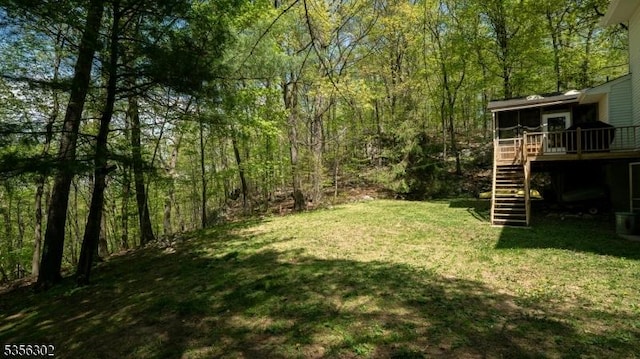 6 Longview Ln, Vernon Twp, NJ 07461 - view of green lawn featuring stairs, a deck, a view of trees, and a sunroom