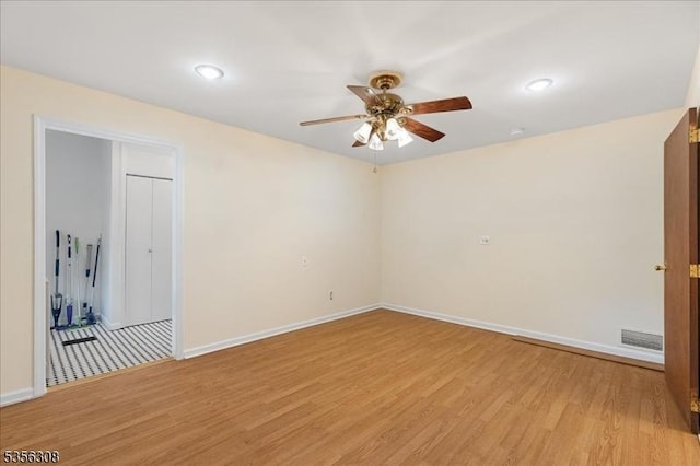 unfurnished room with ceiling fan, light wood-style floors, baseboards, and recessed lighting