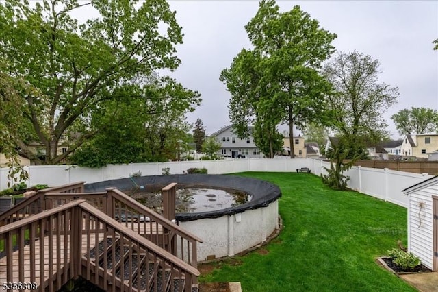 view of yard with a wooden deck and stairs