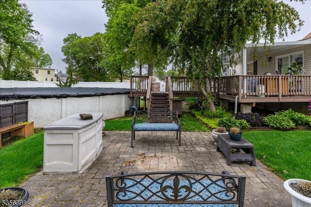 view of patio / terrace with a wooden deck and stairway