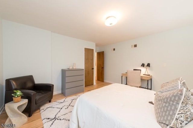 bedroom with light wood-type flooring