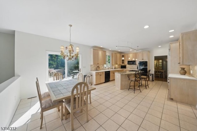 dining space featuring recessed lighting, a chandelier, and light tile patterned floors