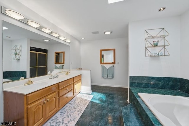 full bath with a bath, double vanity, tile patterned floors, a shower with shower door, and baseboards