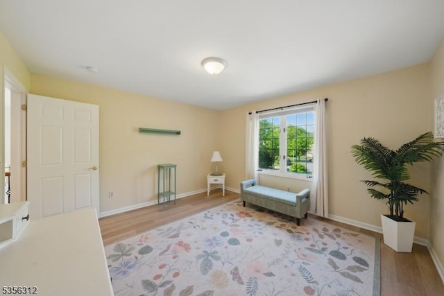 sitting room featuring wood finished floors and baseboards