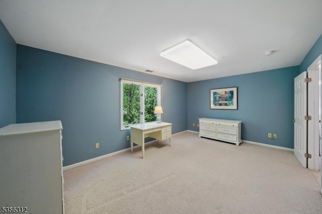 bedroom with carpet flooring and baseboards