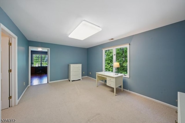 unfurnished bedroom with carpet and baseboards
