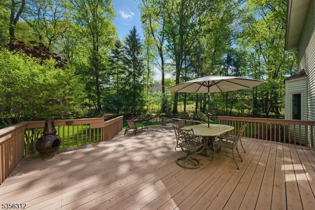deck featuring outdoor dining area