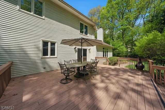 wooden deck with outdoor dining space
