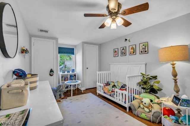 bedroom with wood finished floors and ceiling fan