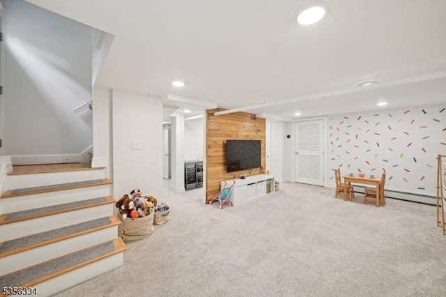 playroom featuring wooden walls, carpet flooring, and recessed lighting
