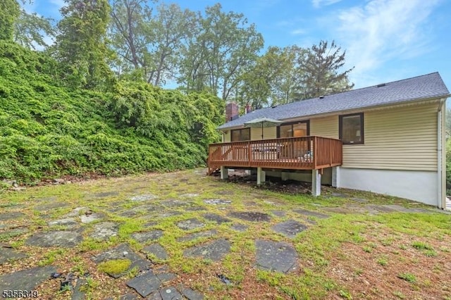 view of yard with a wooden deck
