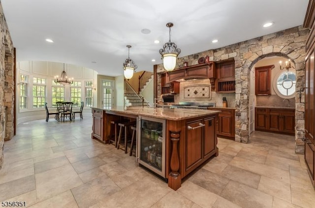 152 Whitebridge Rd, Franklin Twp, NJ 08867 - kitchen with wine cooler, a chandelier, tasteful backsplash, recessed lighting, and decorative light fixtures