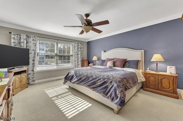 bedroom with light carpet, ornamental molding, baseboards, and a ceiling fan