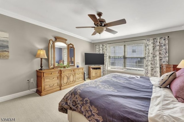 bedroom featuring ornamental molding, baseboards, light colored carpet, and ceiling fan