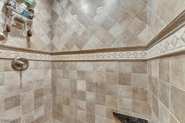 bathroom with a tile shower