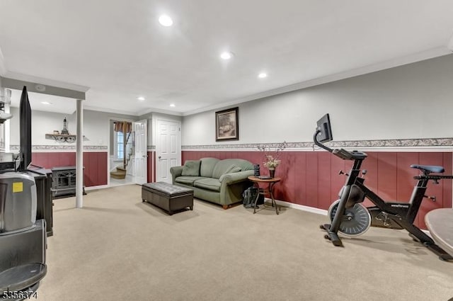 living area with crown molding, light colored carpet, wainscoting, and recessed lighting