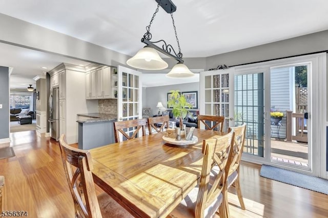 dining room featuring plenty of natural light and light wood-style floors