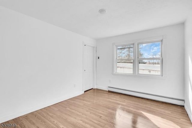 797 Passaic Ave, West Caldwell Twp, NJ 07006 - empty room featuring a baseboard radiator, wood finished floors, and baseboards