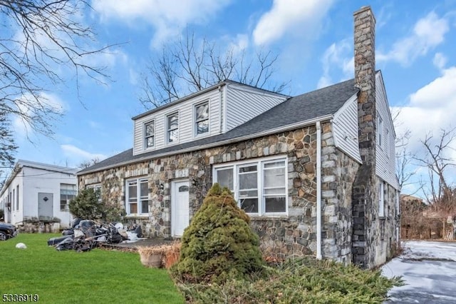 797 Passaic Ave, West Caldwell Twp, NJ 07006 - view of front of property featuring stone siding, a chimney, a front yard, and roof with shingles