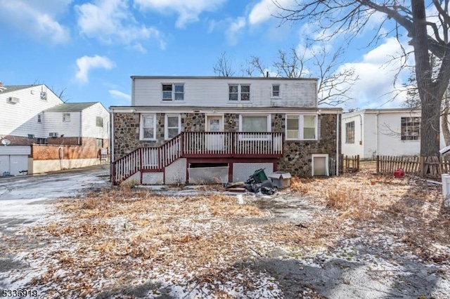 797 Passaic Ave, West Caldwell Twp, NJ 07006 - rear view of property featuring stone siding and fence