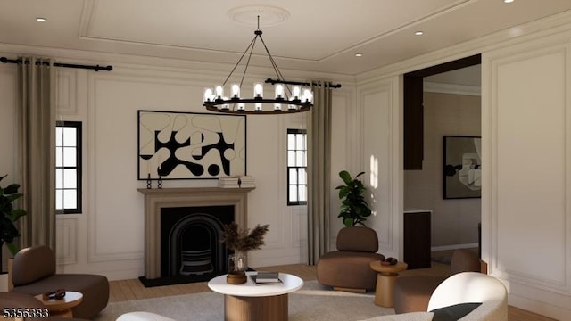living room featuring a fireplace with flush hearth, a decorative wall, healthy amount of natural light, and a chandelier
