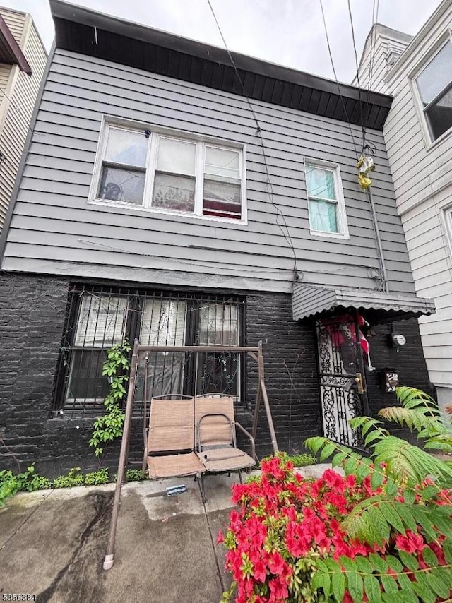 93 Woodlawn Ave, Jersey City, NJ 07305 - view of front facade with brick siding