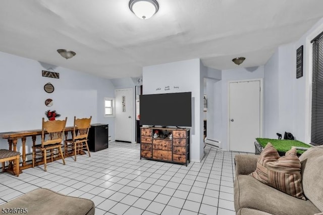 living room featuring a baseboard radiator and light tile patterned floors