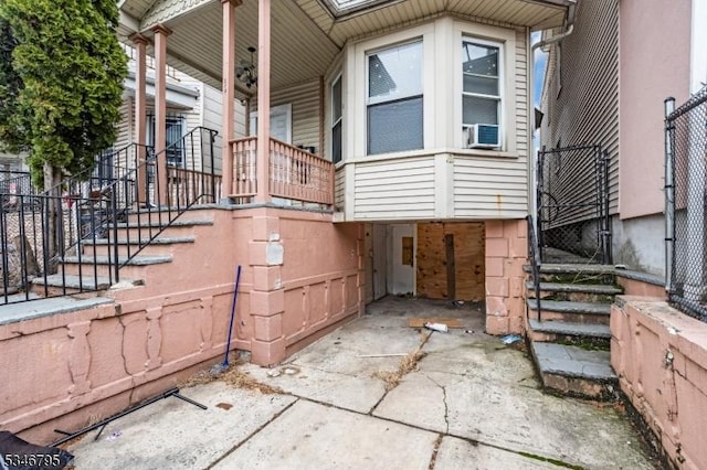 view of side of home featuring a porch
