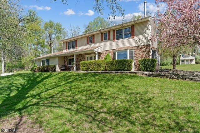75 Wolfs Corner Rd, Green Twp, NJ 07860 - traditional-style home with a front lawn and brick siding