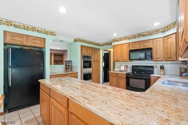 75 Wolfs Corner Rd, Green Twp, NJ 07860 - kitchen with black appliances, a sink, light stone countertops, light tile patterned floors, and decorative backsplash