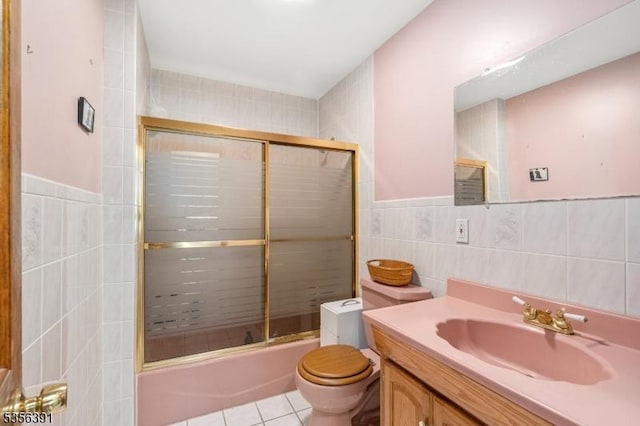 75 Wolfs Corner Rd, Green Twp, NJ 07860 - bathroom with tile walls, tile patterned flooring, combined bath / shower with glass door, toilet, and vanity