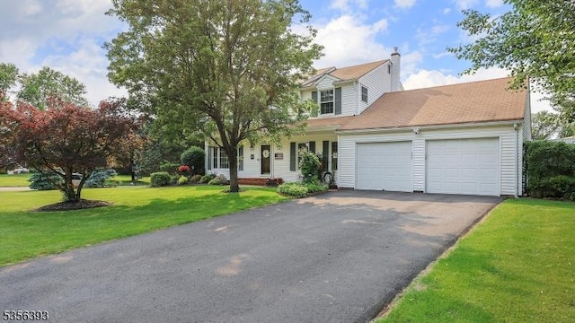 12 Fox Chase Run, Hillsborough Twp, NJ 08844 - view of front facade with an attached garage, driveway, a front lawn, and a chimney