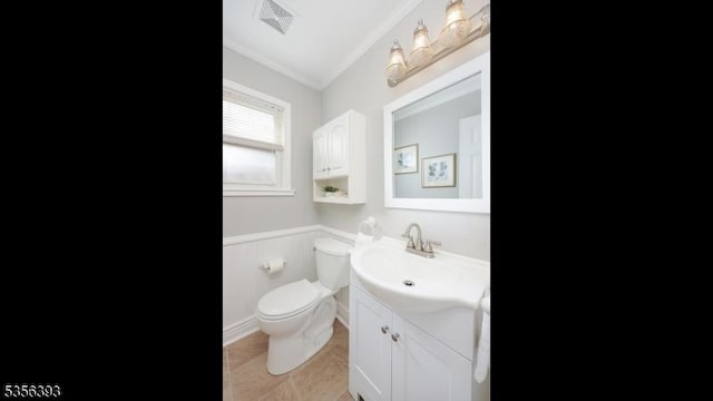 12 Fox Chase Run, Hillsborough Twp, NJ 08844 - half bath featuring vanity, ornamental molding, toilet, tile patterned flooring, and a wainscoted wall