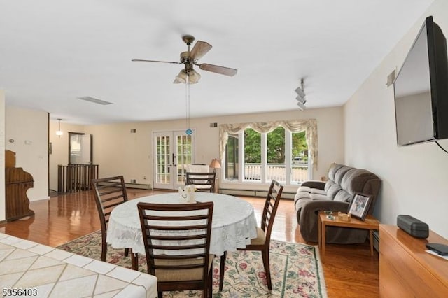87 Ivy Ln, Bridgewater Twp, NJ 08807 - living room featuring light wood-style flooring, ceiling fan, french doors, and rail lighting