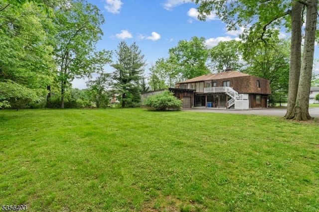 87 Ivy Ln, Bridgewater Twp, NJ 08807 - view of green lawn featuring stairs and a wooden deck