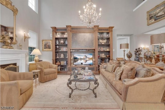 16 Gordon Way, Mount Olive Twp, NJ 07836 - living room featuring a high ceiling, a chandelier, and a fireplace