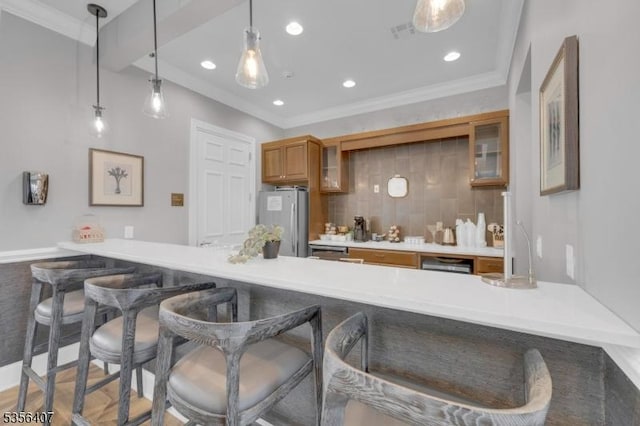 16 Gordon Way, Mount Olive Twp, NJ 07836 - kitchen with freestanding refrigerator, a peninsula, brown cabinets, a kitchen bar, and recessed lighting