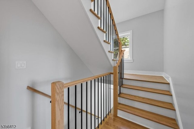 stairway featuring baseboards