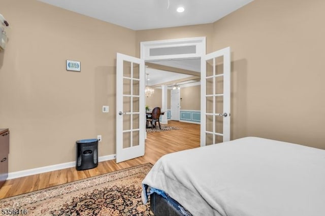 1111 Conrad Way, Franklin Twp, NJ 08873 - bedroom with french doors, wood finished floors, and baseboards