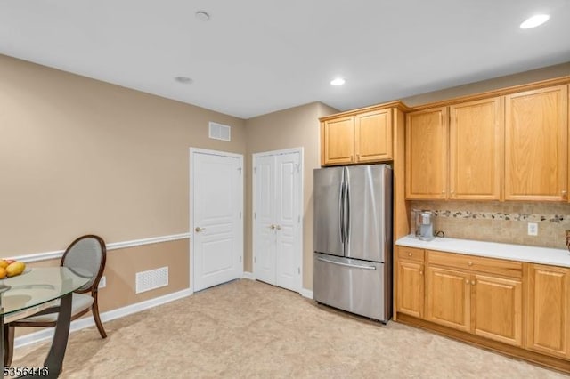 1111 Conrad Way, Franklin Twp, NJ 08873 - kitchen with freestanding refrigerator, light countertops, tasteful backsplash, baseboards, and recessed lighting